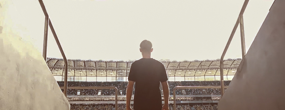 Fan enters stadium 972x376 px_2