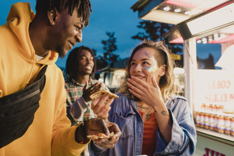 Young Couple Eating Pizza