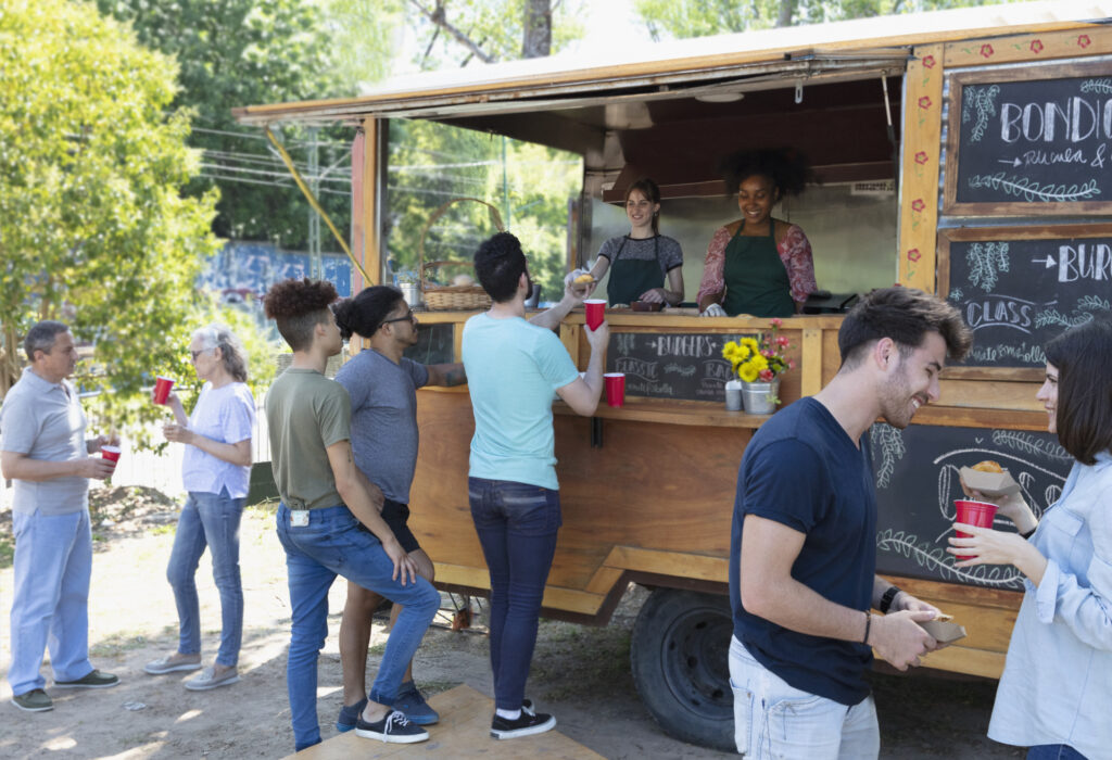people buying food from food truck outside at Food Festival